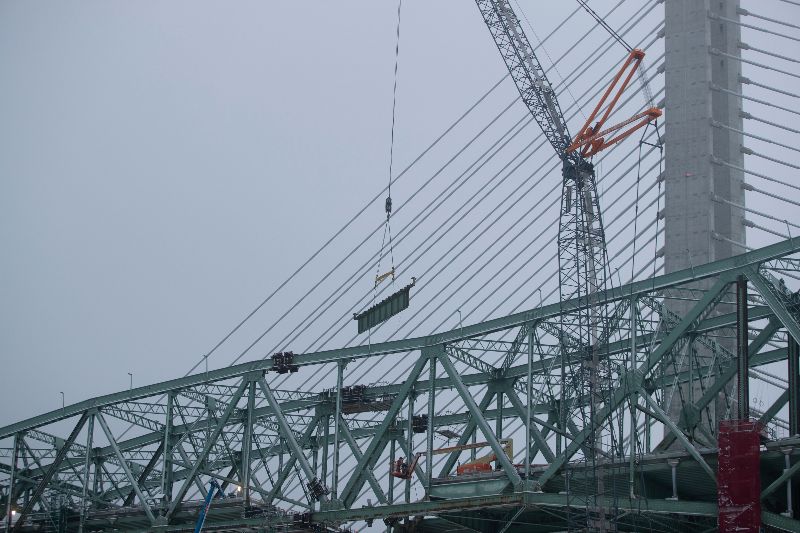 A lifting operation on the cantilevered section of the west span
