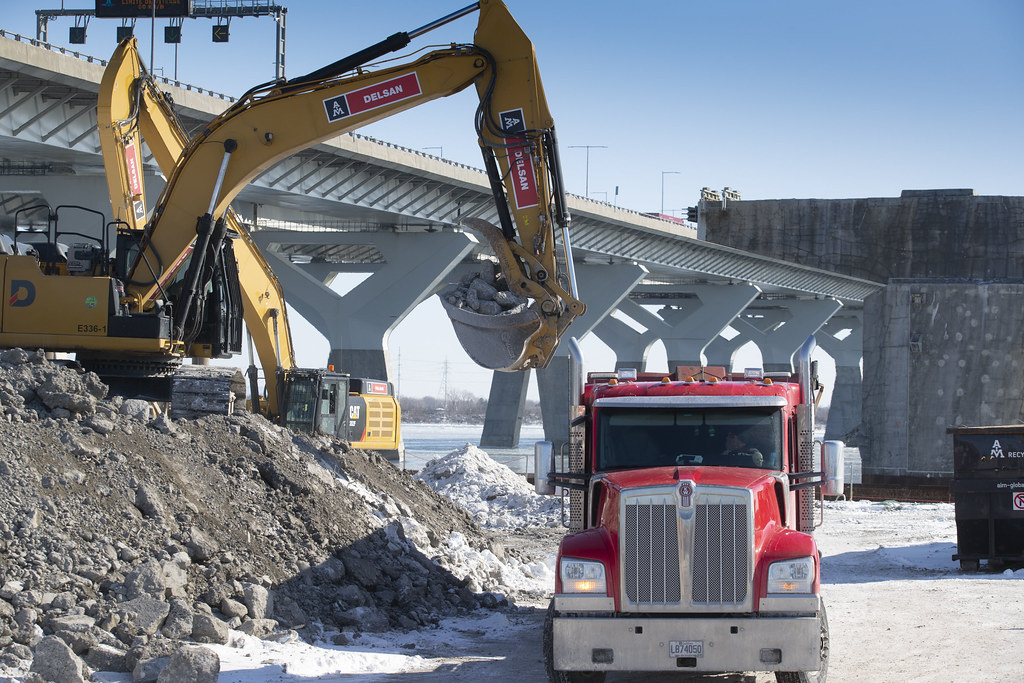Concrete being dumped into trucks